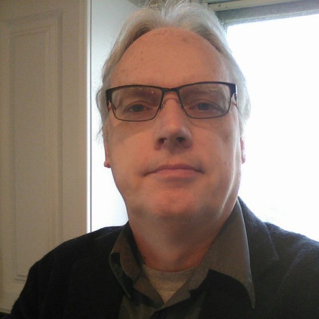 profile picture of Thomas Hentrich. He is causasian and has grey hair. He is wearing dark-framed glasses and is looking directly into the camera with a small smile.